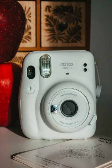 White Instax camera on a desk representing lifestyle photography trends